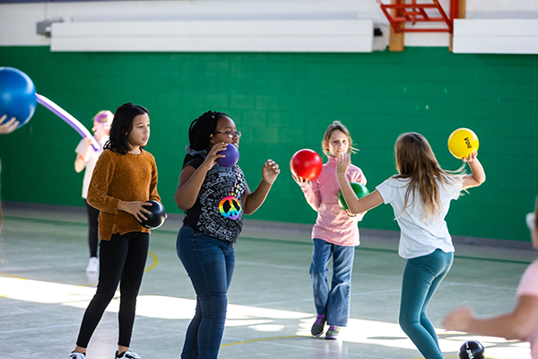 students playing in school gym